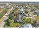 Aerial view of a home featuring solar panels and manicured landscaping in a quiet residential area at 1930 Seclusion Dr, Port Orange, FL 32128