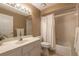 Bathroom with a shower-tub combination, a white vanity, and a neutral color scheme at 1930 Seclusion Dr, Port Orange, FL 32128