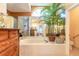Spa-like bathroom with soaking tub, walk-in shower, and large mirrors creating an open feel at 1930 Seclusion Dr, Port Orange, FL 32128