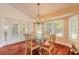 Bright dining room with a glass table and shutters with a view of the outside at 1930 Seclusion Dr, Port Orange, FL 32128