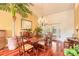 Charming dining area with a large wood table and a view of the outdoors through white shuttered doors at 1930 Seclusion Dr, Port Orange, FL 32128