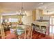 Bright dining room with a glass table and chairs, seamlessly connected to the kitchen at 1930 Seclusion Dr, Port Orange, FL 32128
