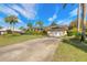 Lovely home with an expansive driveway, a two-car garage, and well-kept landscaping at 1930 Seclusion Dr, Port Orange, FL 32128