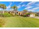 Attractive home with a manicured lawn and a welcoming front entrance framed by lush greenery at 1930 Seclusion Dr, Port Orange, FL 32128