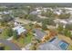 Aerial shot of a home with well-maintained landscaping and mature trees within a defined lot boundary at 1930 Seclusion Dr, Port Orange, FL 32128