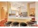 Bright kitchen featuring modern appliances, white cabinets and countertop seating at 1930 Seclusion Dr, Port Orange, FL 32128