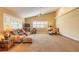 Inviting living room with carpet floors, vaulted ceilings, and sunlit windows, creating a cozy atmosphere at 1930 Seclusion Dr, Port Orange, FL 32128