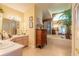Lovely main bathroom with double sinks, soaking tub, and large mirrors for ample lighting at 1930 Seclusion Dr, Port Orange, FL 32128