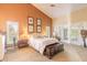 Spacious main bedroom featuring a high ceiling and bright windows, perfect for relaxation at 1930 Seclusion Dr, Port Orange, FL 32128