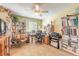 Home office space with built-in bookshelves, a ceiling fan, and ample workspace at 1930 Seclusion Dr, Port Orange, FL 32128