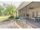 Screened-in patio offers a transition to the lush backyard and serene landscaping at 1930 Seclusion Dr, Port Orange, FL 32128
