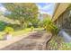 A covered patio overlooks the backyard, offering a comfortable space for enjoying the outdoors at 1930 Seclusion Dr, Port Orange, FL 32128
