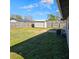 View of backyard, shed, and AC unit at 213 Lone Pine Dr, Edgewater, FL 32132