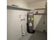 Unfinished basement with water heater and shelving at 213 Lone Pine Dr, Edgewater, FL 32132