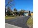 Ranch-style home with a paved driveway and landscaped lawn at 213 Lone Pine Dr, Edgewater, FL 32132