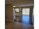 Eat-in kitchen with white cabinets and vinyl flooring at 213 Lone Pine Dr, Edgewater, FL 32132