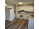 Bright kitchen featuring white cabinets and a new stove at 213 Lone Pine Dr, Edgewater, FL 32132