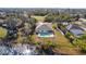 Aerial view of a house with a pool, located near a lake at 2370 Alton Rd, Deltona, FL 32738