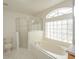 Bathroom boasts a shower, bathtub, and updated fixtures at 2370 Alton Rd, Deltona, FL 32738