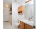 Clean bathroom with shower, toilet, vanity, and linen cabinet at 2370 Alton Rd, Deltona, FL 32738