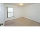 Well-lit bedroom with window, ceiling fan and carpet flooring at 2370 Alton Rd, Deltona, FL 32738