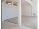 Open living area with neutral carpeting, tile floors, and an arched entryway at 2370 Alton Rd, Deltona, FL 32738