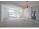 Bright and airy living room with neutral decor and an arched entryway at 2370 Alton Rd, Deltona, FL 32738