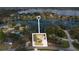 Aerial view of lakeside home showing the surrounding neighborhood and scenic lake at 2424 India Blvd, Deltona, FL 32738