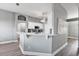 Modern kitchen with white cabinetry, quartz countertop, and stainless steel appliances at 2424 India Blvd, Deltona, FL 32738