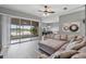 Open-concept living area with lake views, tile floors, and a comfortable sectional sofa at 2424 India Blvd, Deltona, FL 32738
