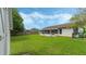 Spacious backyard offering a grassy area and a shed at 2625 Sweet Springs St, Deltona, FL 32738