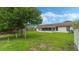 Large backyard with grassy area, mature tree, and shed at 2625 Sweet Springs St, Deltona, FL 32738