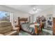 Bedroom with a comfortable recliner and backyard view at 2625 Sweet Springs St, Deltona, FL 32738