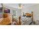 Bedroom with floral bedding and wood furniture at 2625 Sweet Springs St, Deltona, FL 32738