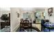 Dining area with dark wood table and view into kitchen at 2625 Sweet Springs St, Deltona, FL 32738