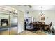 Dining area with dark wood table and chairs near kitchen at 2625 Sweet Springs St, Deltona, FL 32738