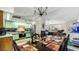 Dining area with dark wood table and chairs, kitchen view at 2625 Sweet Springs St, Deltona, FL 32738