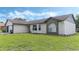 House exterior showcasing brick and vinyl siding with a well-maintained lawn at 2625 Sweet Springs St, Deltona, FL 32738