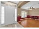 Bright entryway with hardwood floors, two-toned walls, and white door at 265 Palmetto Springs St, Debary, FL 32713