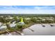 Aerial view of waterfront home with private dock and lush landscaping at 2806 Bay Vista Ct, New Smyrna Beach, FL 32168