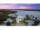 Luxury waterfront home with circular driveway and stunning sunset views at 2806 Bay Vista Ct, New Smyrna Beach, FL 32168