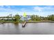 Waterfront home showcasing private dock at 2806 Bay Vista Ct, New Smyrna Beach, FL 32168