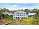 Luxury waterfront home showcasing expansive backyard and dock access at 2806 Bay Vista Ct, New Smyrna Beach, FL 32168