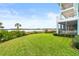 Spacious backyard with water views and lush landscaping at 2806 Bay Vista Ct, New Smyrna Beach, FL 32168