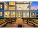 Screened porch with firepit and wooden walkway leading to waterfront at 2806 Bay Vista Ct, New Smyrna Beach, FL 32168