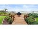 Relaxing patio with fire pit and water views at 2806 Bay Vista Ct, New Smyrna Beach, FL 32168