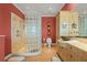 Bathroom with a glass block shower and modern vanity at 2806 Bay Vista Ct, New Smyrna Beach, FL 32168