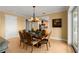 Elegant dining room with hardwood floors and access to kitchen at 2806 Bay Vista Ct, New Smyrna Beach, FL 32168