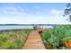 Long wooden walkway to private dock at 2806 Bay Vista Ct, New Smyrna Beach, FL 32168