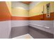 Bright elevator with multicolored walls and wood floors at 2806 Bay Vista Ct, New Smyrna Beach, FL 32168